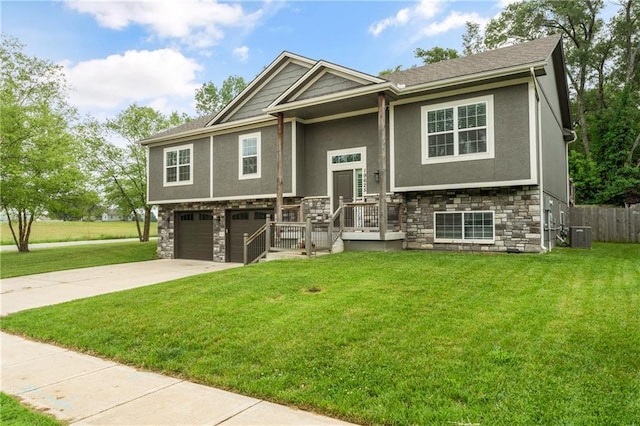 19625 E 18th Ter, Independence, MO 64057 - raised ranch featuring stone siding, stucco siding, a garage, concrete driveway, and cooling unit