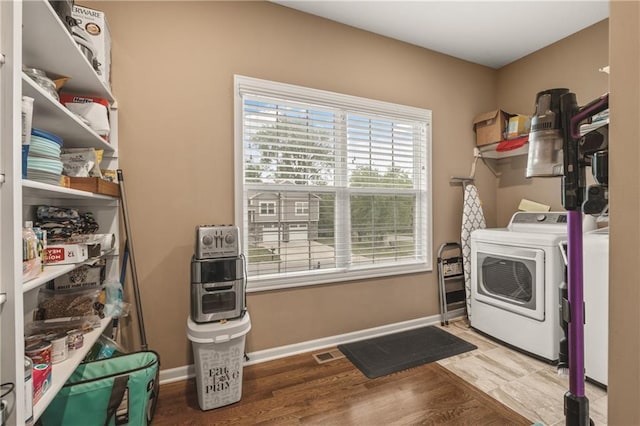 19625 E 18th Ter, Independence, MO 64057 - laundry area with wood finished floors and baseboards