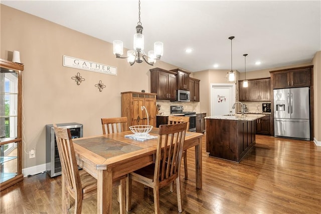 19625 E 18th Ter, Independence, MO 64057 - dining room featuring dark wood-type flooring, a chandelier, baseboards, and recessed lighting