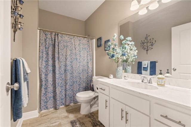 19625 E 18th Ter, Independence, MO 64057 - bathroom with vanity, toilet, and a shower with shower curtain