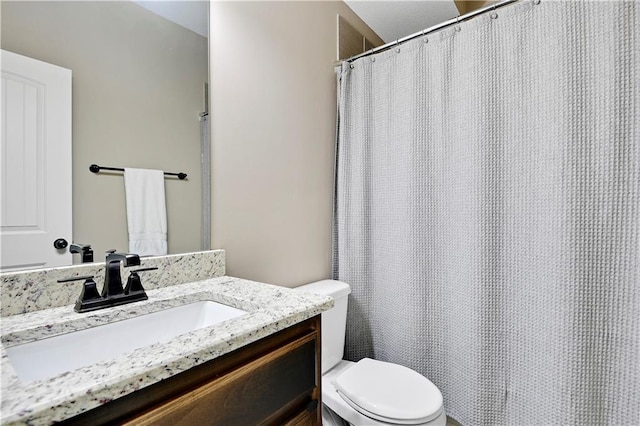 full bathroom with vanity and toilet