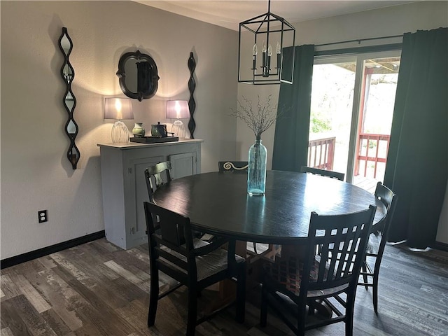 dining area featuring baseboards and dark wood finished floors