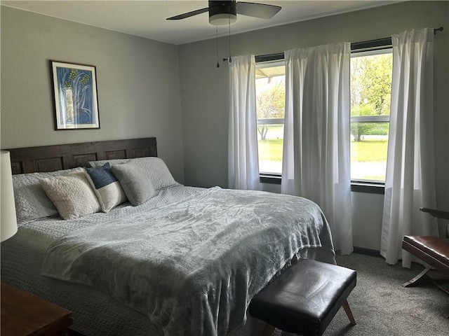 bedroom with multiple windows and carpet flooring