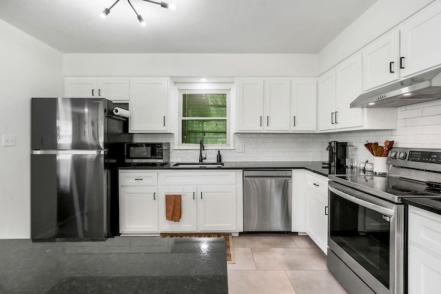 416 NE Carriage St, Lees Summit, MO 64064 - kitchen featuring stainless steel appliances, a sink, under cabinet range hood, and dark countertops