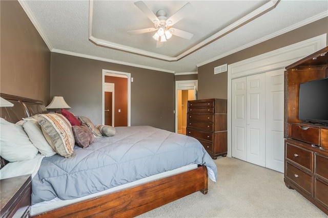 7428 N Smalley Ave, Kansas City, MO 64158 - bedroom with light carpet, a raised ceiling, ornamental molding, a closet, and ceiling fan