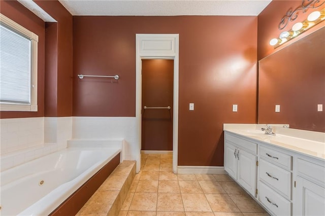 7428 N Smalley Ave, Kansas City, MO 64158 - full bath with vanity, a jetted tub, baseboards, and tile patterned floors