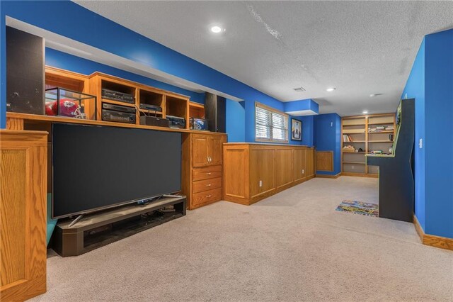 7428 N Smalley Ave, Kansas City, MO 64158 - playroom featuring a textured ceiling and carpet floors
