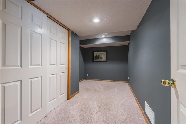 7428 N Smalley Ave, Kansas City, MO 64158 - unfurnished bedroom featuring a textured ceiling, carpet, baseboards, and recessed lighting