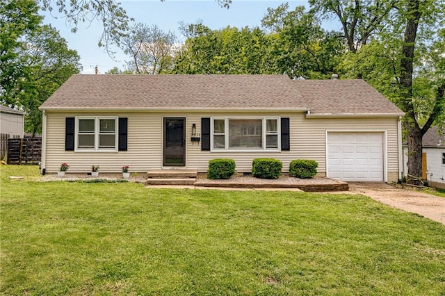 ranch-style home featuring concrete driveway, a garage, and roof with shingles