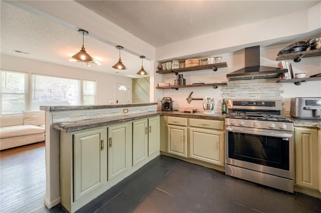 kitchen with gas stove, wall chimney range hood, open shelves, a textured ceiling, and a peninsula