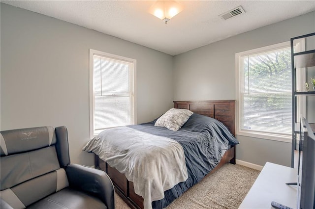 bedroom featuring carpet floors and baseboards