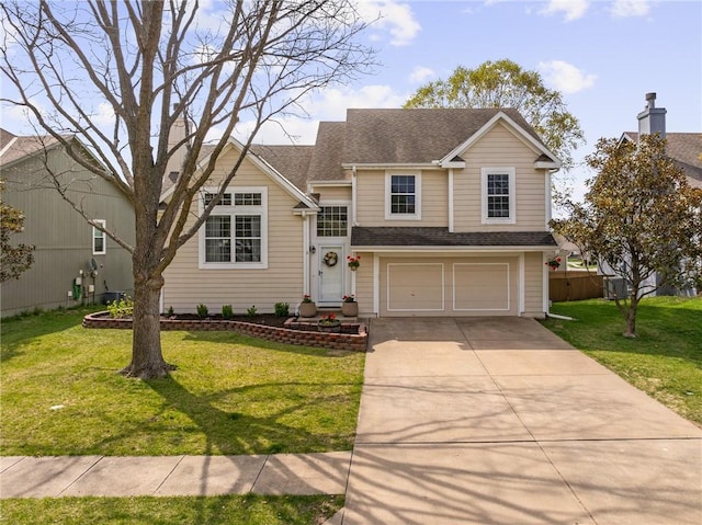 split level home featuring a front yard, an attached garage, a shingled roof, and concrete driveway