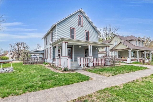 316 W 5th Ave, Garnett, KS 66032 - view of front of house with a porch and a front yard