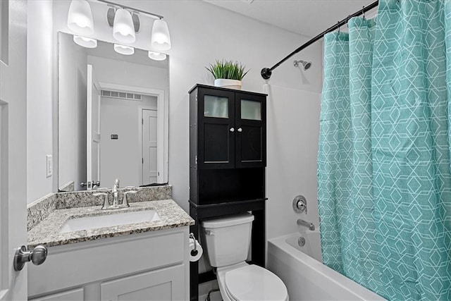 full bathroom featuring vanity, shower / bath combination with curtain, and toilet