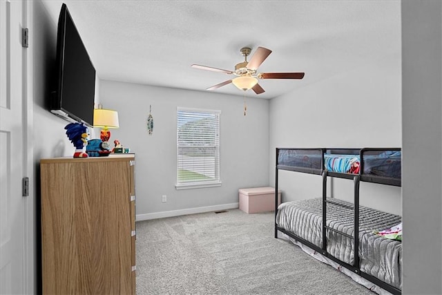 bedroom featuring carpet floors, baseboards, and ceiling fan