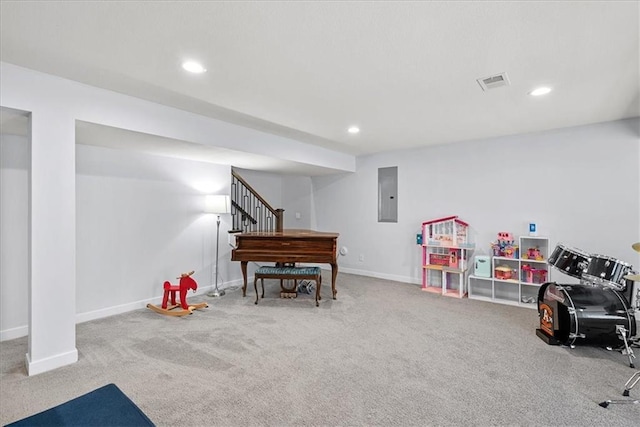 recreation room with carpet floors, baseboards, and visible vents