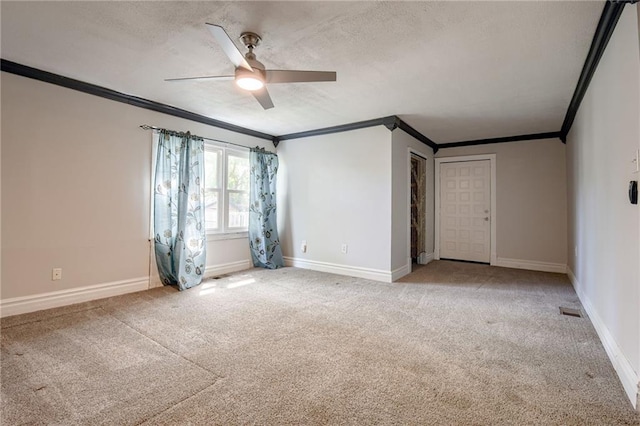 unfurnished room featuring ornamental molding, ceiling fan, light carpet, a textured ceiling, and baseboards