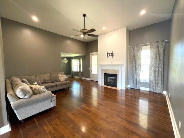 3106 Mill Ct, Pittsburg, KS 66762 - living room featuring wood finished floors, a ceiling fan, a fireplace, baseboards, and recessed lighting