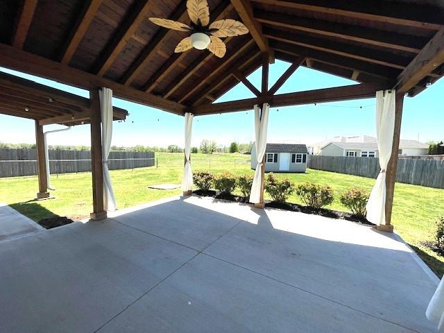3106 Mill Ct, Pittsburg, KS 66762 - view of patio / terrace with ceiling fan, an outdoor structure, and a storage shed