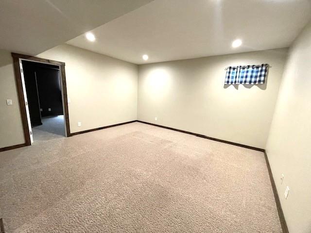3106 Mill Ct, Pittsburg, KS 66762 - unfurnished room with light carpet, baseboards, and recessed lighting