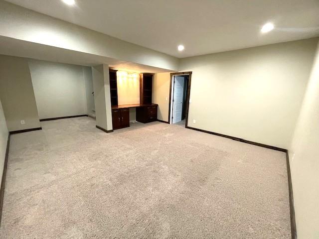 3106 Mill Ct, Pittsburg, KS 66762 - finished below grade area featuring recessed lighting, baseboards, and light carpet