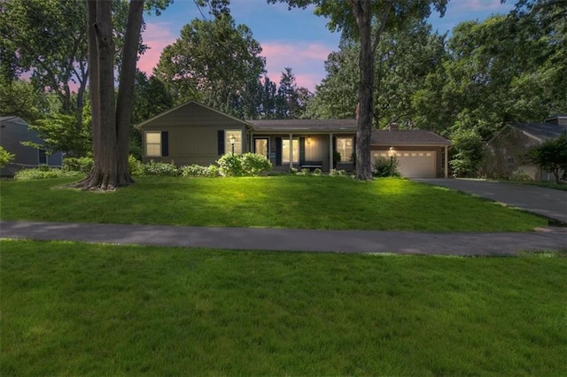 1215 W 69th Ter, Kansas City, MO 64113 - single story home featuring driveway, a garage, and a yard