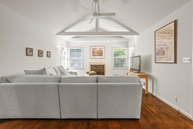 1215 W 69th Ter, Kansas City, MO 64113 - living area with a ceiling fan and dark wood-style flooring