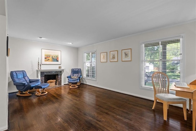 1215 W 69th Ter, Kansas City, MO 64113 - sitting room featuring healthy amount of natural light, wood finished floors, a fireplace, and ornamental molding