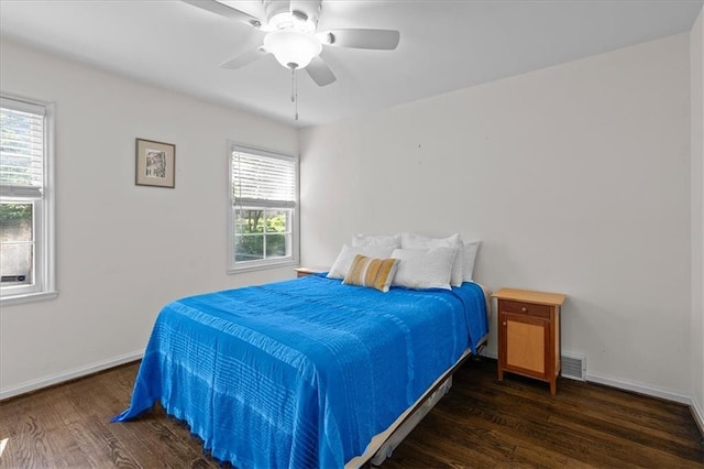 1215 W 69th Ter, Kansas City, MO 64113 - bedroom featuring wood finished floors and a ceiling fan