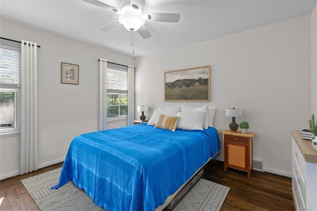1215 W 69th Ter, Kansas City, MO 64113 - bedroom with wood finished floors and a ceiling fan