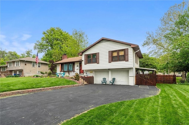 13613 Lowell Ave, Grandview, MO 64030 - tri-level home with an attached garage and driveway