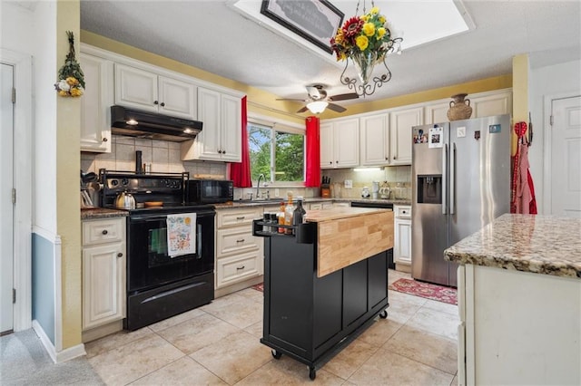 13613 Lowell Ave, Grandview, MO 64030 - kitchen with black appliances, under cabinet range hood, decorative backsplash, and a sink