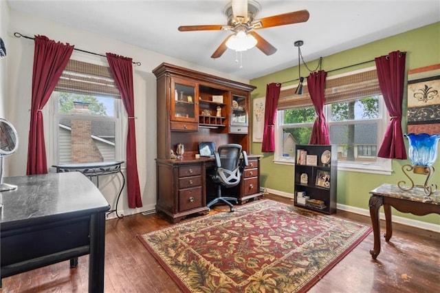 13613 Lowell Ave, Grandview, MO 64030 - home office with ceiling fan, dark wood finished floors, and baseboards
