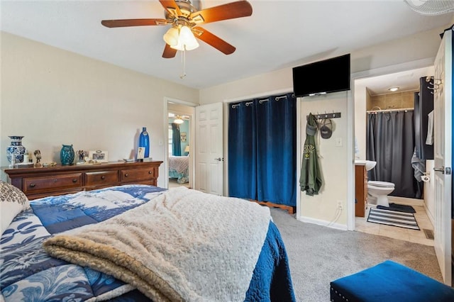 13613 Lowell Ave, Grandview, MO 64030 - bedroom with light colored carpet, baseboards, a ceiling fan, and connected bathroom