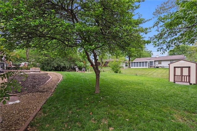 13613 Lowell Ave, Grandview, MO 64030 - view of grassy yard featuring a shed and an outdoor structure