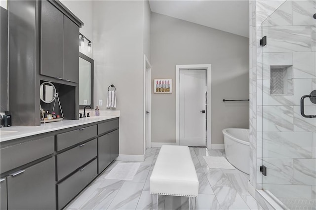 full bath with baseboards, double vanity, a stall shower, and a soaking tub