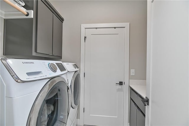 laundry area featuring cabinet space and independent washer and dryer