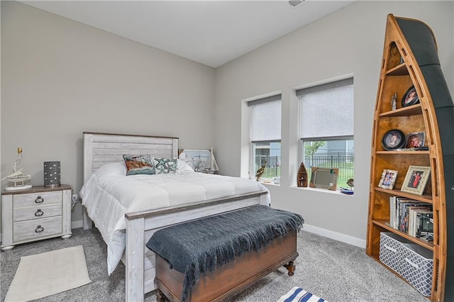 carpeted bedroom with baseboards