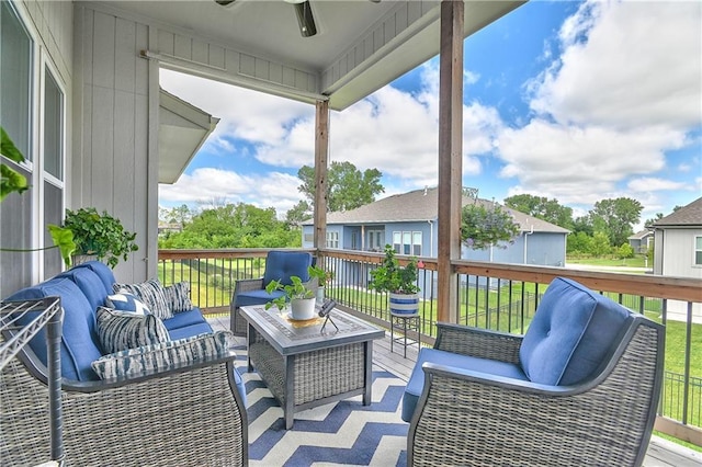 deck with ceiling fan and outdoor lounge area