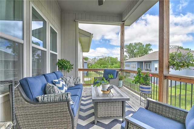 view of wooden balcony featuring a deck and outdoor lounge area