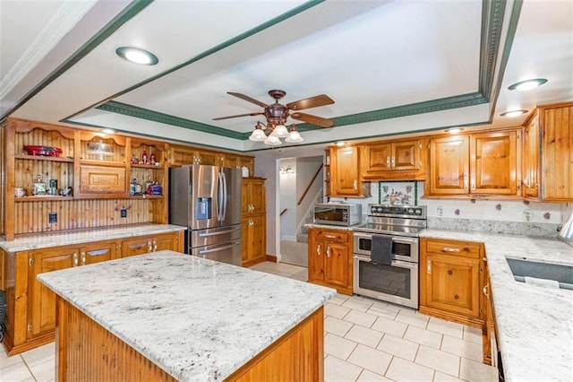 24545 W 54th St, Shawnee, KS 66226 - kitchen with appliances with stainless steel finishes, a raised ceiling, light tile patterned floors, ceiling fan, and ornamental molding