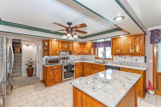 24545 W 54th St, Shawnee, KS 66226 - kitchen with stainless steel appliances, crown molding, a sink, a ceiling fan, and brown cabinets