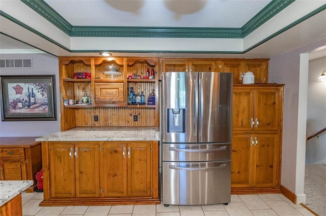 24545 W 54th St, Shawnee, KS 66226 - kitchen featuring stainless steel refrigerator with ice dispenser, brown cabinets, and light stone countertops