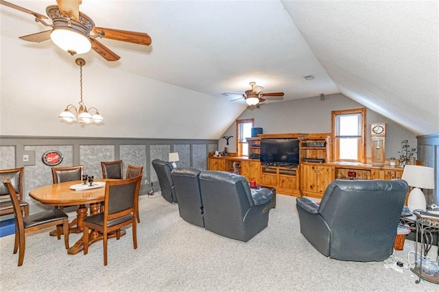 24545 W 54th St, Shawnee, KS 66226 - carpeted living area featuring ceiling fan, lofted ceiling, and a chandelier