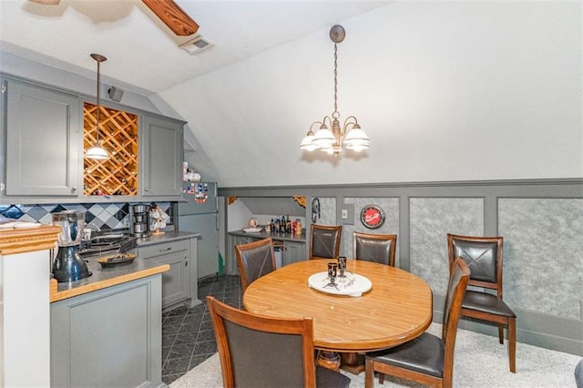 24545 W 54th St, Shawnee, KS 66226 - dining space with lofted ceiling and a chandelier