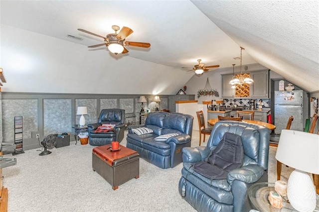 24545 W 54th St, Shawnee, KS 66226 - living area featuring a ceiling fan, lofted ceiling, and carpet floors