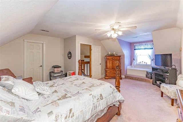 24545 W 54th St, Shawnee, KS 66226 - bedroom with vaulted ceiling, light carpet, a ceiling fan, and a textured ceiling