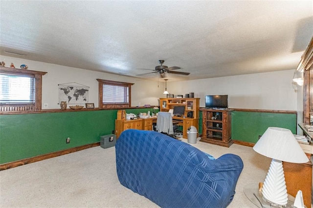 24545 W 54th St, Shawnee, KS 66226 - living area featuring carpet floors, a ceiling fan, a textured ceiling, plenty of natural light, and baseboards