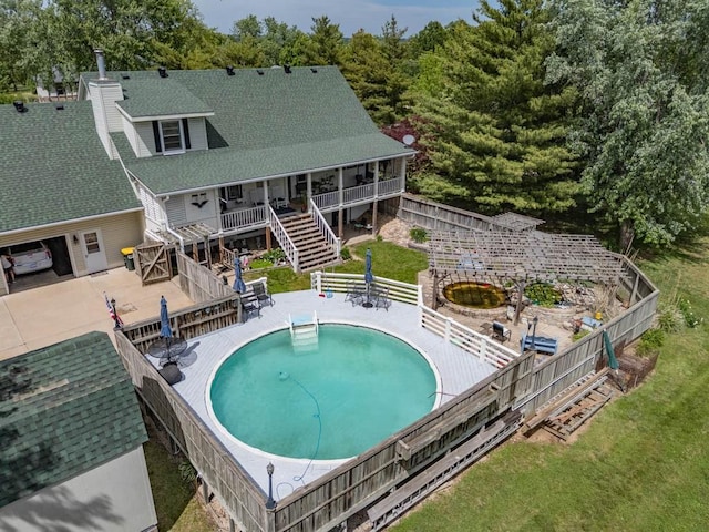 24545 W 54th St, Shawnee, KS 66226 - swimming pool featuring stairs, a fenced backyard, and a deck