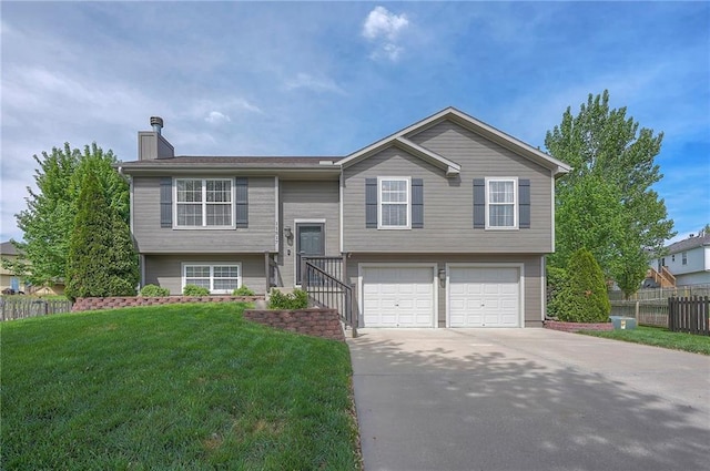 11517 N Laurel Ct, Kansas City, MO 64157 - bi-level home with a chimney, concrete driveway, and an attached garage